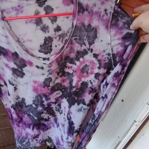 Tie dye shirts with the breast cancer awareness ribbon .